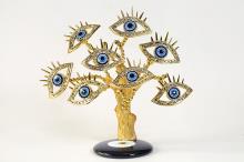 ARBOL OJO TURCO CON FORMAS DE OJO Y PESTAAS COLOR DORADO EN BASE PLANA DE OJO TURCO 20 CM