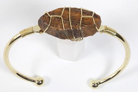 COLLARES, PULSERAS, PENDIENTES Y ANILLOS | BRAZALETE ABIERTO METAL DORADO CON OJO DE TIGRE EN BRUTO 6,5X6CM